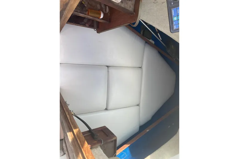 Slide: The Image of Interior cabin of 1984 Hydra-Sports 2250 WA boat with white cushions. - 6