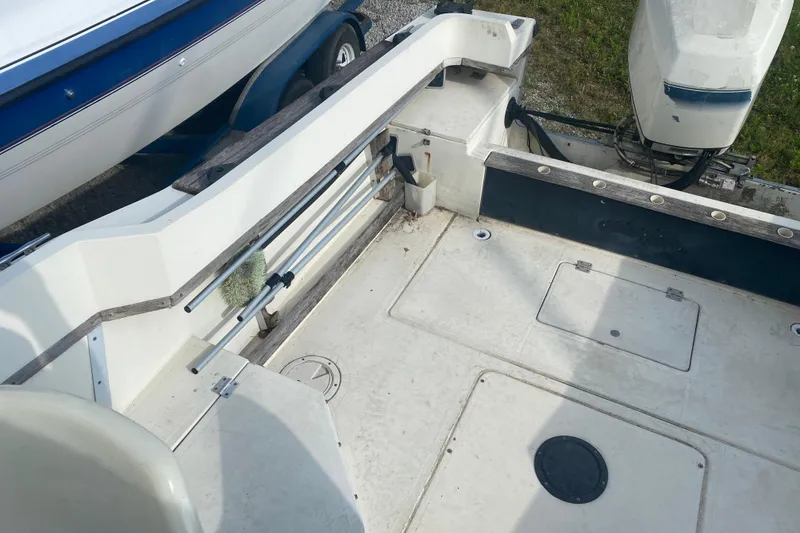 Slide: The Image of 1984 Hydra-Sports 2250 WA boat interior with motor and storage compartments. - 8