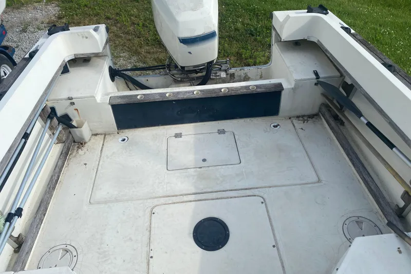 Slide: The Image of 1984 Hydra-Sports 2250 WA boat interior with motor and storage compartments. - 9