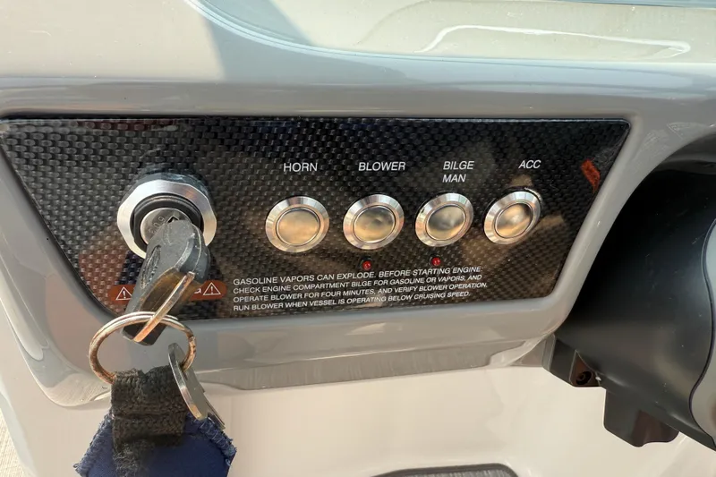 Slide: The Image of Control panel of 2020 Chaparral 21 Surf boat with ignition and function buttons. - 11