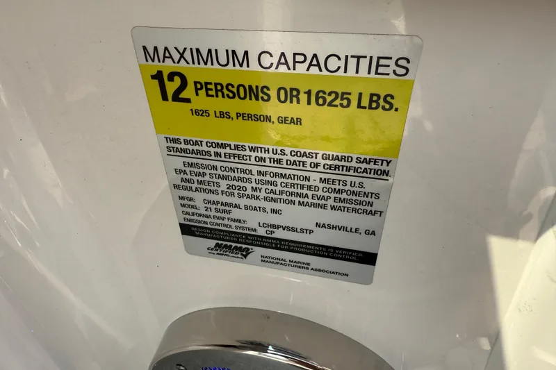 Slide: The Image of 2020 Chaparral 21 Surf capacity label: 12 persons or 1625 lbs, U.S. Coast Guard compliant. - 12