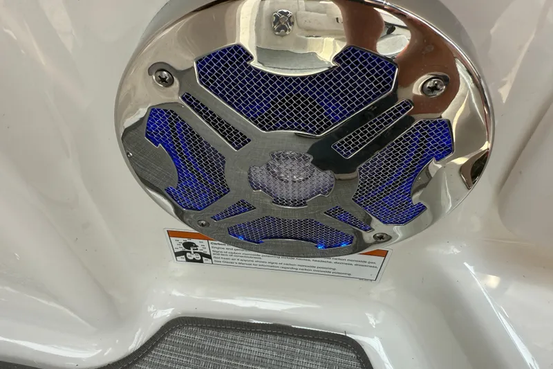 Slide: The Image of Chrome speaker with blue accents on 2020 Chaparral 21 Surf boat interior. - 13