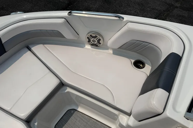 Slide: The Image of 2020 Chaparral 21 Surf boat interior with cushioned seating and speaker. - 15