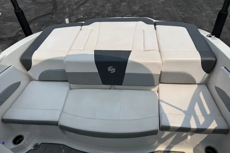 Slide: The Image of 2020 Chaparral 21 Surf boat interior with white and gray seating. - 18