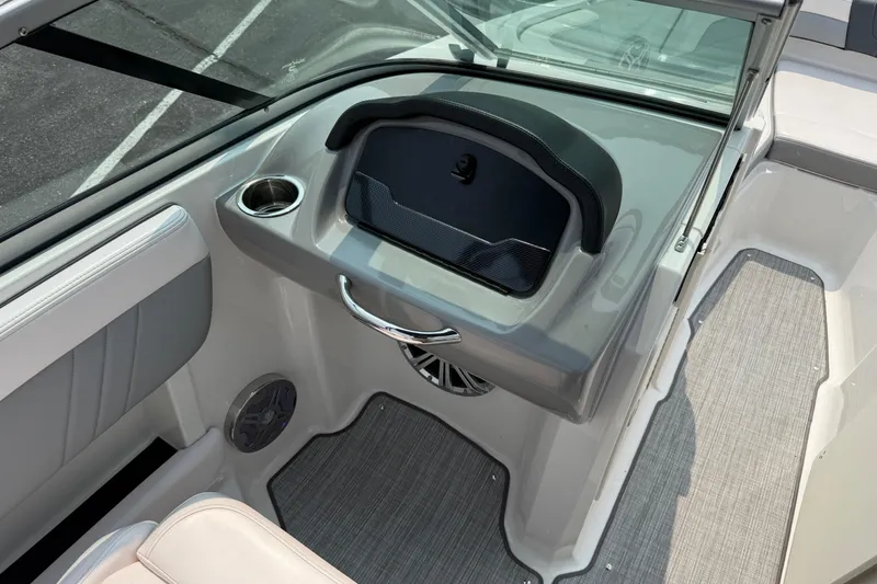 Slide: The Image of 2020 Chaparral 21 Surf boat interior with cup holder and speaker. - 22