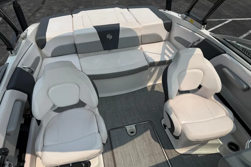 Slide: The Image of Interior of 2020 Chaparral 21 Surf boat with white and gray seating. - 28