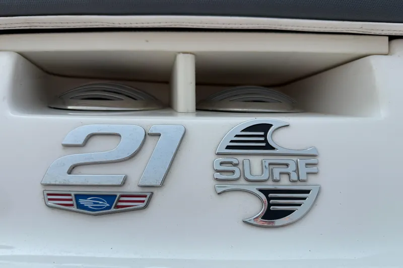 Slide: The Image of 2020 Chaparral 21 Surf boat emblem with sleek design and branding. - 31