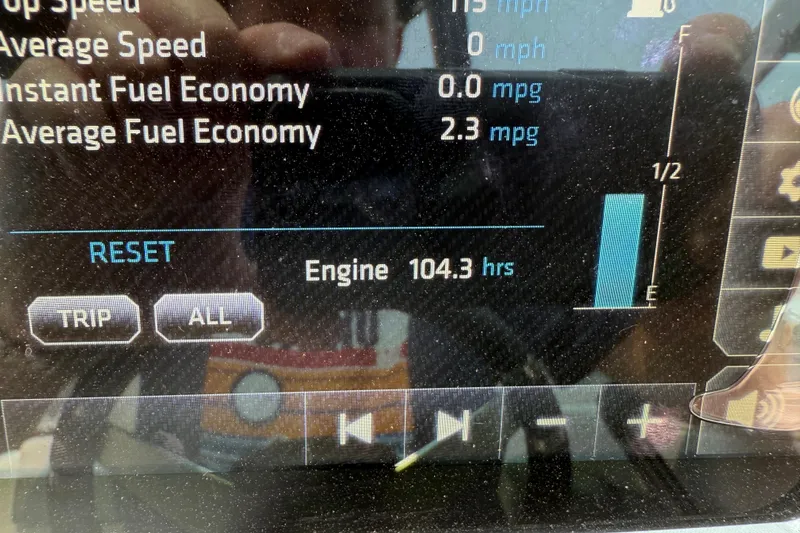 Slide: The Image of Dashboard display of a 2020 Chaparral 21 Surf showing engine hours and fuel economy. - 8