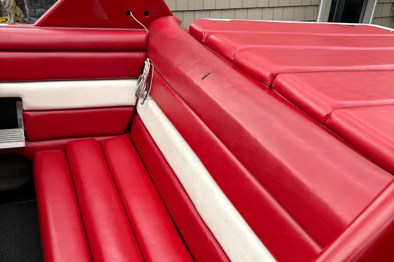 Slide: The Image of Red and white interior seating of a 1988 Fountain 38 boat. - 5