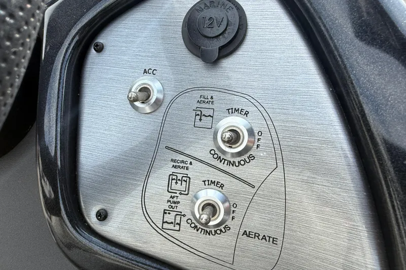 Slide: The Image of Control panel of 2018 Tracker Pro Team 175 TXW boat with switches and 12V outlet. - 13