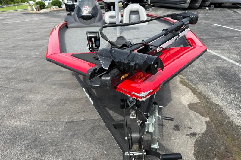 Slide: The Image of 2018 Tracker Pro Team 175 TXW boat with red hull and trolling motor. - 15
