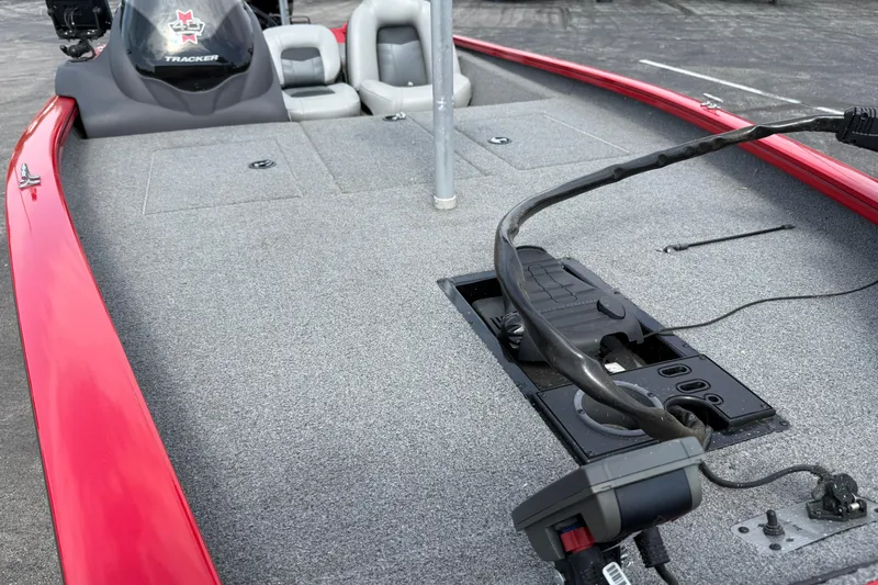 Slide: The Image of 2018 Tracker Pro Team 175 TXW boat with red trim and gray interior. - 16