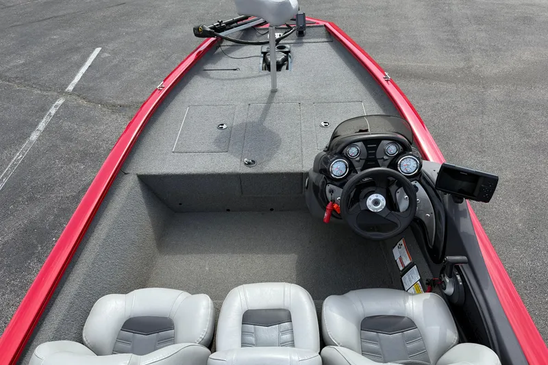 Slide: The Image of 2018 Tracker Pro Team 175 TXW boat interior with steering console and seating. - 17