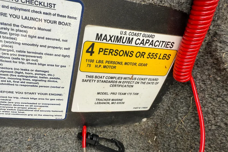 Slide: The Image of 2018 Tracker Pro Team 175 TXW capacity label, 4 persons or 555 lbs, safety compliance. - 20