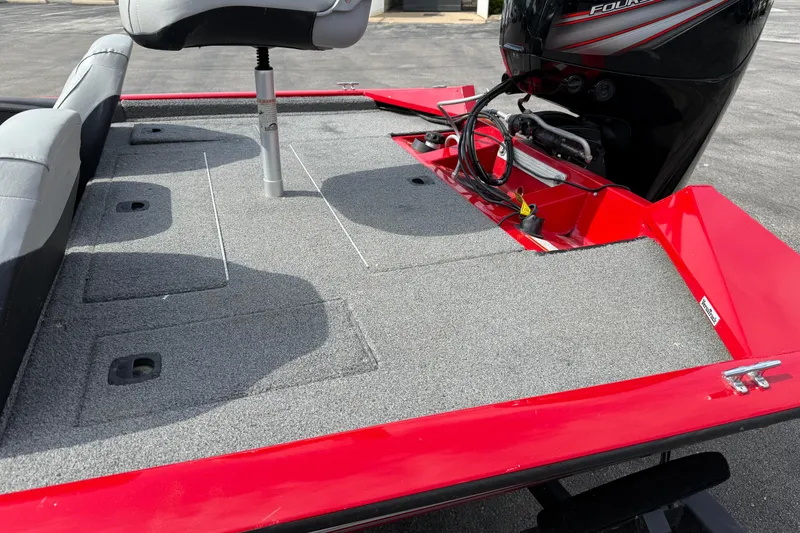 Slide: The Image of 2018 Tracker Pro Team 175 TXW boat with red exterior and gray interior seating. - 8