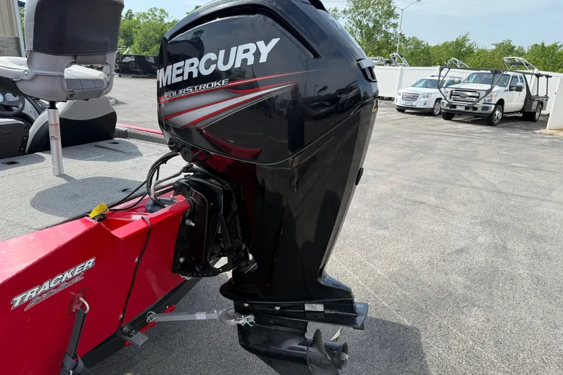 Slide: The Image of 2018 Tracker Pro Team 175 TXW boat with Mercury FourStroke engine in parking lot. - 9