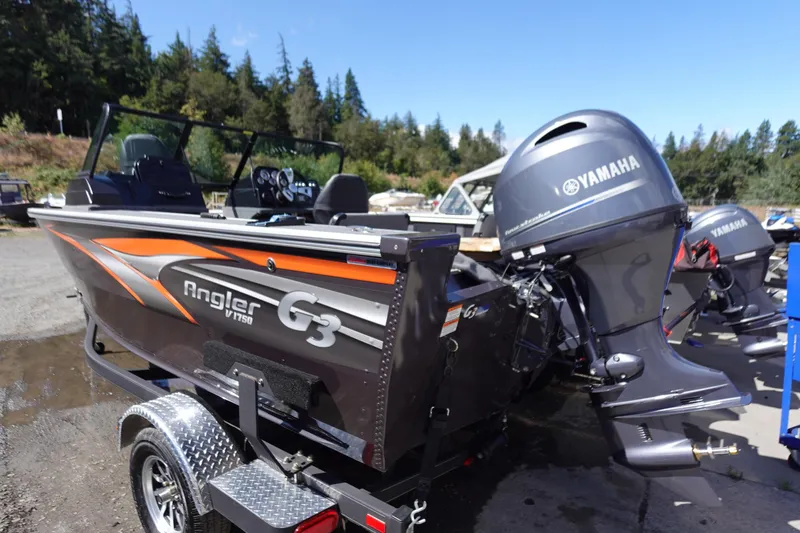 Slide: The Image of 2025 G3 Angler V1750SF boat with Yamaha motor, parked outdoors. - 18