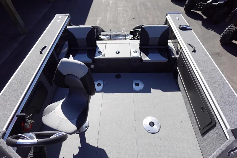 Slide: The Image of 2025 G3 Angler V1750SF boat interior with seating and steering wheel. - 23