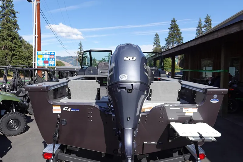 Slide: The Image of 2025 G3 Angler V1750SF boat with Yamaha 90 engine, parked outdoors. - 26