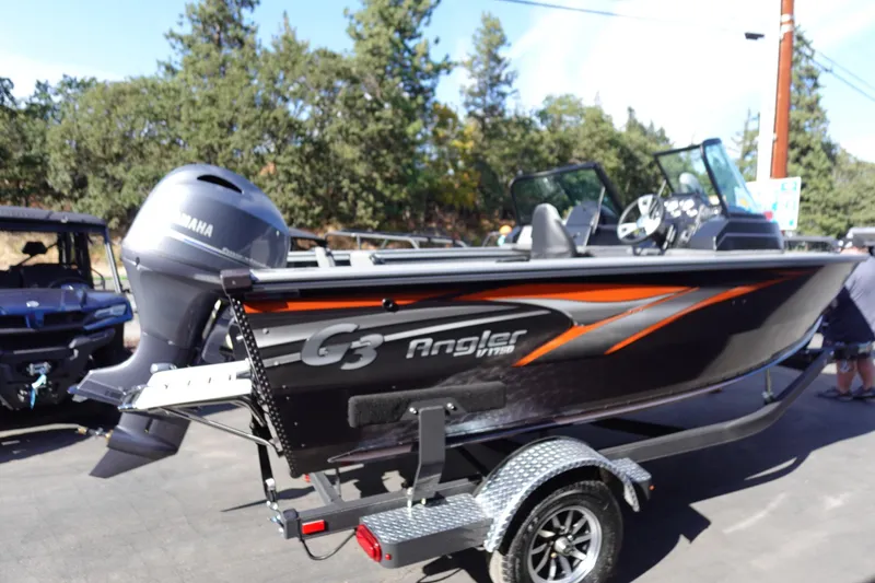 Slide: The Image of 2025 G3 Angler V1750SF boat on trailer with Yamaha motor, outdoors. - 4