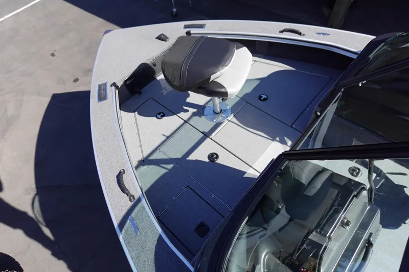 Slide: The Image of 2025 G3 Angler V1750SF boat deck with swivel seat and storage compartments. - 7