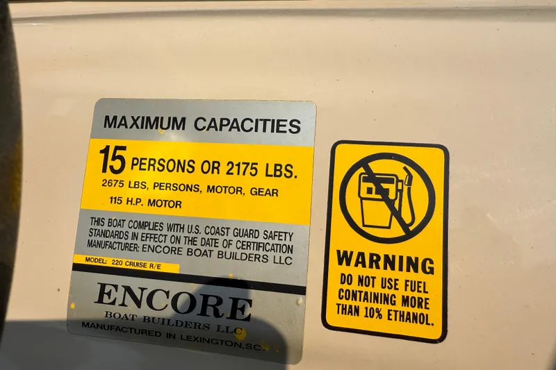 Slide: The Image of 2012 Bentley Pontoons 220 Cruise capacity and fuel warning labels. - 14