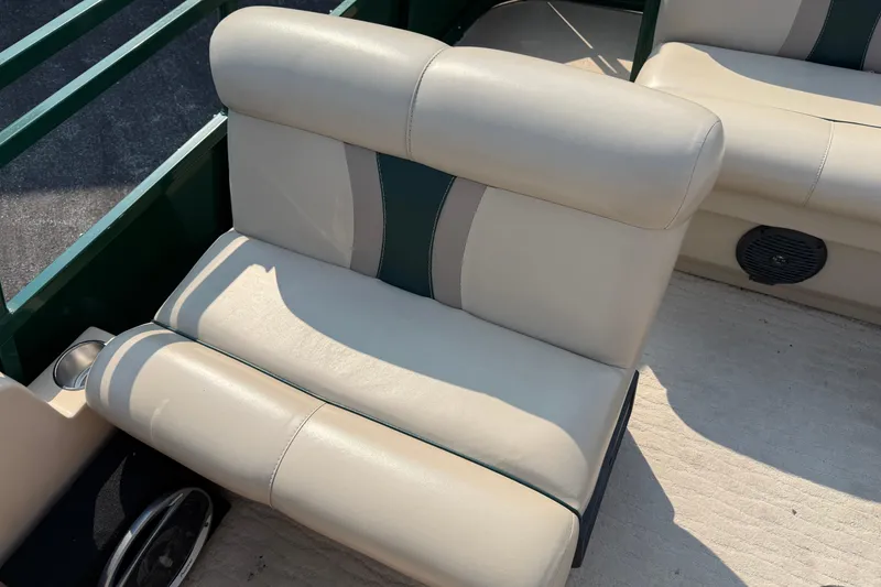 Slide: The Image of 2012 Bentley Pontoons 220 Cruise beige seating with cup holder and speaker. - 17