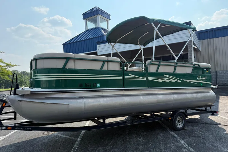 Slide: The Image of 2012 Bentley Pontoons 220 Cruise on trailer, green exterior, parked outdoors. - 3