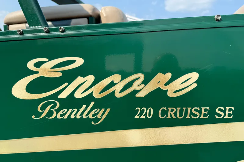 Slide: The Image of Green Bentley Pontoons 220 Cruise SE with gold lettering, 2012 model. - 4