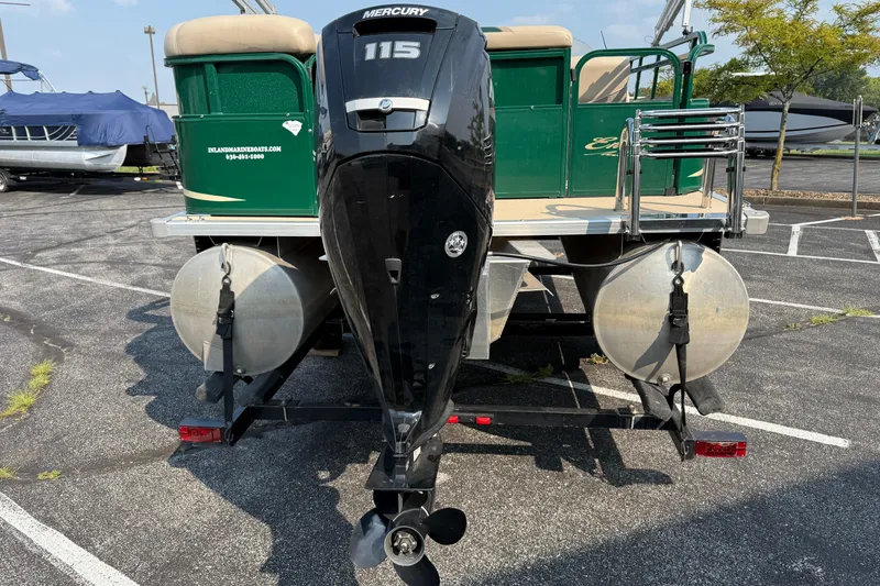 Slide: The Image of 2012 Bentley Pontoons 220 Cruise with Mercury 115 outboard motor in a parking lot. - 5