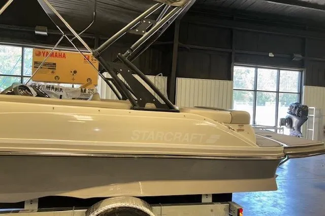 Slide: The Image of 2022 Starcraft Starstep 221 boat in indoor showroom, side view. - 11