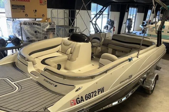 Slide: The Image of 2022 Starcraft Starstep 221 boat with seating, displayed indoors. - 13