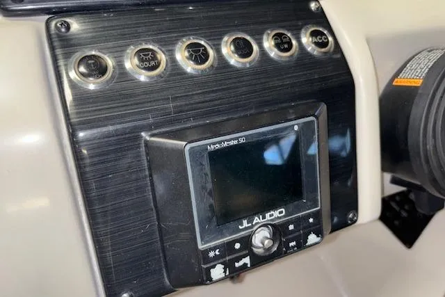 Slide: The Image of Control panel of 2022 Starcraft Starstep 221 boat with JL Audio system. - 22