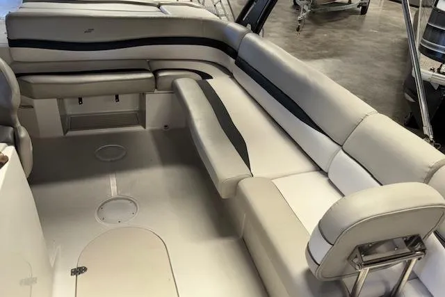 Slide: The Image of 2022 Starcraft Starstep 221 boat interior with beige seating and spacious layout. - 23