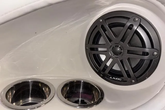 Slide: The Image of Speaker and cup holders in 2022 Starcraft Starstep 221 boat interior. - 24