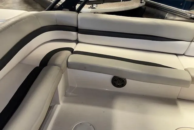 Slide: The Image of 2022 Starcraft Starstep 221 boat interior with gray and black cushioned seating. - 25