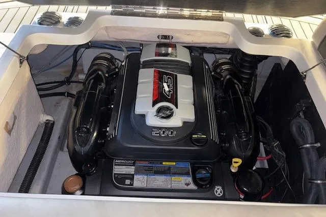 Slide: The Image of 2022 Starcraft Starstep 221 boat engine compartment with powerful Mercury 4.5L engine. - 27