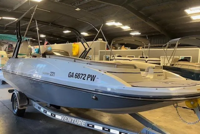 Slide: The Image of 2022 Starcraft Starstep 221 boat on trailer in indoor showroom. - 3