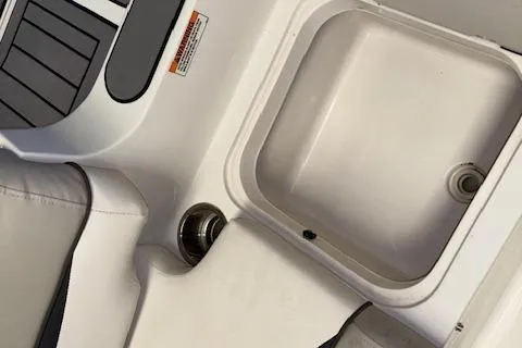 Slide: The Image of 2022 Starcraft Starstep 221 boat interior with storage compartment and seating. - 32