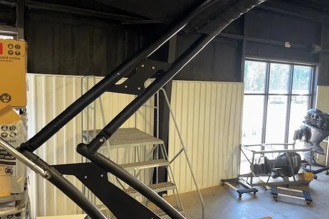 Slide: The Image of Interior view of a workshop with a 2022 Starcraft Starstep 221 boat component. - 36