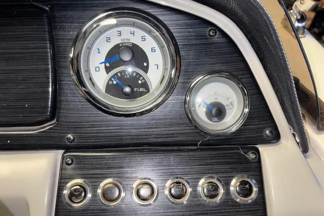 Slide: The Image of Dashboard of a 2022 Starcraft Starstep 221 boat with gauges and controls. - 38