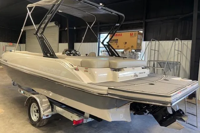 Slide: The Image of 2022 Starcraft Starstep 221 boat on trailer in indoor storage facility. - 8