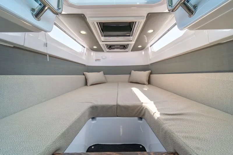 Slide: The Image of 2021 Axopar Cross Cabin interior with cozy seating and modern design. - 28