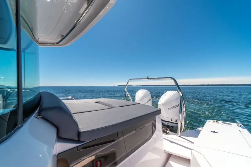 Slide: The Image of 2021 Axopar Cross Cabin boat with Mercury engines on open water. - 35