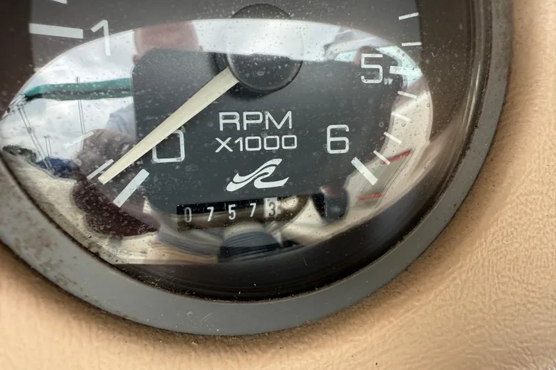 Slide: The Image of Close-up of a 1995 Sea Ray 220 Cuddy Cabin RPM gauge showing 757.5 hours. - 13