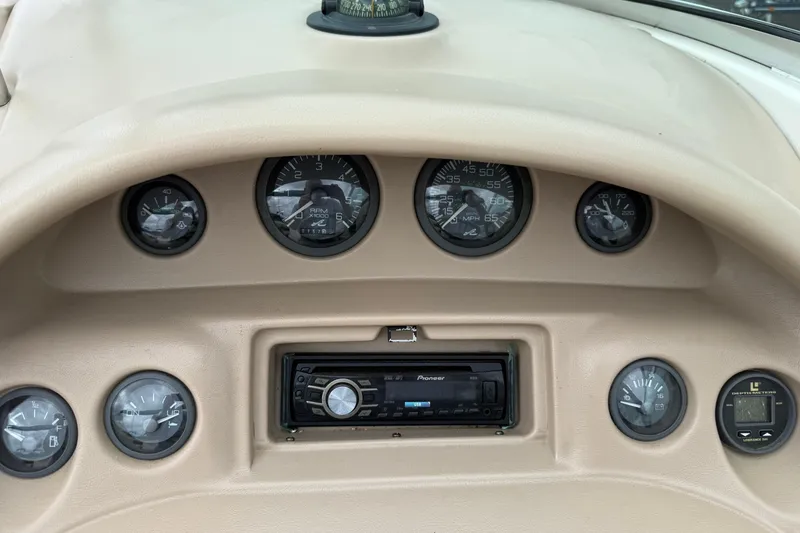 Slide: The Image of Dashboard of a 1995 Sea Ray 220 Cuddy Cabin with gauges and Pioneer stereo system. - 18