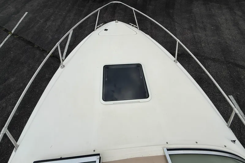 Slide: The Image of 1995 Sea Ray 220 Cuddy Cabin boat deck with hatch, viewed from above. - 24