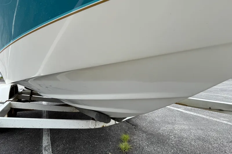Slide: The Image of 1995 Sea Ray 220 Cuddy Cabin boat on trailer, close-up of hull and bow. - 29