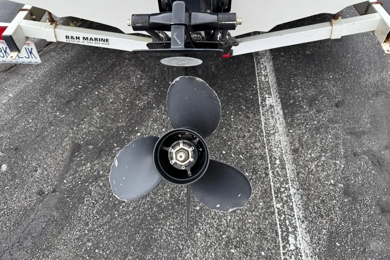 Slide: The Image of Propeller of a 1995 Sea Ray 220 Cuddy Cabin boat on a trailer. - 8