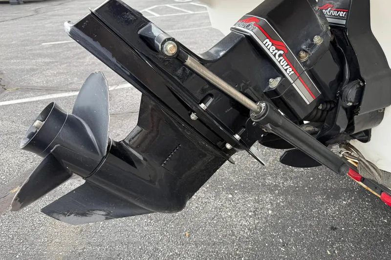 Slide: The Image of 1995 Sea Ray 220 Cuddy Cabin boat with MerCruiser outdrive in parking lot. - 9